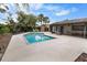 Backyard pool with a spacious patio and relaxing seating area at 13501 Avista Dr, Tampa, FL 33624