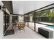 Relaxing screened patio with outdoor dining area and view of the pool at 13501 Avista Dr, Tampa, FL 33624