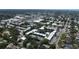 An aerial view captures the condo community with landscaping, water features, and ample parking space at 14130 Rosemary Ln # 3202, Largo, FL 33774