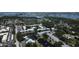 Aerial view of condo community with parking, pool, pond with fountains and a walkable bridge at 14130 Rosemary Ln # 3202, Largo, FL 33774