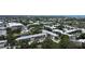 A serene view of the tranquil lake, verdant trees, and refreshing pool at 14130 Rosemary Ln # 3202, Largo, FL 33774