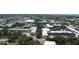 A captivating aerial view of the peaceful lake, verdant trees, and inviting pool at 14130 Rosemary Ln # 3202, Largo, FL 33774