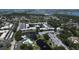 Aerial view of condo community with parking, pool, pond with fountains and a walkable bridge at 14130 Rosemary Ln # 3202, Largo, FL 33774