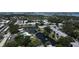 An aerial perspective features condos encircling a tranquil pond and a refreshing pool, ideal for relaxation and leisure at 14130 Rosemary Ln # 3202, Largo, FL 33774