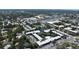Birds-eye view of the condominium complex showcasing central water features, landscaping, and parking areas at 14130 Rosemary Ln # 3202, Largo, FL 33774