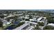 Aerial view of the community featuring manicured landscaping, lakes, and a pool at 14130 Rosemary Ln # 3202, Largo, FL 33774