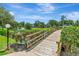 Charming wooden bridge overlooking a tranquil pond in a well-maintained community at 14130 Rosemary Ln # 3202, Largo, FL 33774