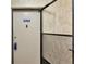 Apartment front door with security screen and unit number at 14130 Rosemary Ln # 3202, Largo, FL 33774
