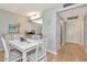 Hallway that leads into the dining area, which flows into the kitchen with access to the main entrance at 14130 Rosemary Ln # 3202, Largo, FL 33774