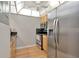 The kitchen features a stainless steel refrigerator, microwave, and oven with space to move around at 14130 Rosemary Ln # 3202, Largo, FL 33774