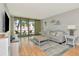 Spacious living room with access to the screened in porch at 14130 Rosemary Ln # 3202, Largo, FL 33774