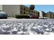 View of the parking lot in front of the complex and covered parking spots in the back at 14130 Rosemary Ln # 3202, Largo, FL 33774