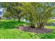 Picturesque pond featuring a fountain, mature trees, ducks, and plenty of shade at 14130 Rosemary Ln # 3202, Largo, FL 33774