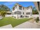 The backyard features artificial turf, a putting green, AC unit and white rock landscaping at 1650 22Nd N Ave, St Petersburg, FL 33713