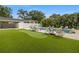 Lush backyard with an inviting pool, putting green, and plenty of space for lounging at 1650 22Nd N Ave, St Petersburg, FL 33713