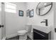 Modern bathroom with sleek vanity, stylish mirror, and updated fixtures at 1650 22Nd N Ave, St Petersburg, FL 33713
