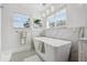 Luxurious bathroom with a freestanding tub, marble accents, and designer lighting for a spa-like experience at 1650 22Nd N Ave, St Petersburg, FL 33713