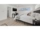 Well-lit bedroom featuring large windows, a ceiling fan, and minimalist contemporary furniture at 1650 22Nd N Ave, St Petersburg, FL 33713