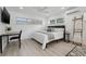 Bright bedroom with large windows, a ceiling fan, and sleek, modern decor at 1650 22Nd N Ave, St Petersburg, FL 33713