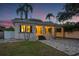Charming home featuring a carport, a brick driveway, and lush landscaping, offering both style and functionality at 1650 22Nd N Ave, St Petersburg, FL 33713