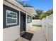 Exterior view features a black front door with a side access to the backyard at 1650 22Nd N Ave, St Petersburg, FL 33713