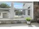 A bright, white window frames the home's pool and patio area with outdoor seating at 1650 22Nd N Ave, St Petersburg, FL 33713