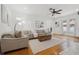 Cozy living room featuring hardwood floors, a comfortable seating arrangement, and abundant natural light at 1650 22Nd N Ave, St Petersburg, FL 33713