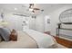 Spacious main bedroom with a modern sliding barn door leading to the ensuite bathroom at 1650 22Nd N Ave, St Petersburg, FL 33713
