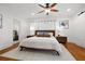 Bright main bedroom with wood floors, a ceiling fan, and contemporary decor, creating a peaceful retreat at 1650 22Nd N Ave, St Petersburg, FL 33713