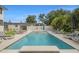 Backyard pool with stylish lounge chairs and lush greenery at 1650 22Nd N Ave, St Petersburg, FL 33713