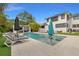 Gorgeous outdoor pool area with modern lounge chairs and inviting umbrellas at 1650 22Nd N Ave, St Petersburg, FL 33713