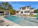 Modern pool area with integrated spa, stylish lounge furniture, and backyard entertainment space at 1650 22Nd N Ave, St Petersburg, FL 33713