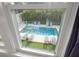 Tranquil outdoor view of a sparkling pool area, complete with lounge chairs and lush landscaping at 1650 22Nd N Ave, St Petersburg, FL 33713