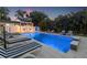 Luxurious pool area, including comfortable seating, lush landscaping and custom features, offering relaxation and entertainment at 1650 22Nd N Ave, St Petersburg, FL 33713