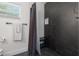Modern shower featuring black tile and white walls at 1650 22Nd N Ave, St Petersburg, FL 33713