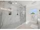 Modern walk-in shower featuring marble tile, a glass enclosure, and rainfall showerhead for a spa-like experience at 1650 22Nd N Ave, St Petersburg, FL 33713