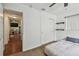 Bedroom with carpet flooring, closet, and shelves, offering a cozy and functional space at 1707 Cardinal Dr, Clearwater, FL 33759