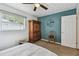 Bedroom with carpet flooring, ceiling fan, and natural light; creating an inviting and comfortable atmosphere at 1707 Cardinal Dr, Clearwater, FL 33759