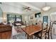 Bright and airy living space with hardwood floors, large windows, and comfortable seating at 1707 Cardinal Dr, Clearwater, FL 33759
