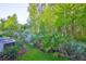 Lush greenery and privacy surround this backyard space, creating a serene outdoor retreat at 17834 Althea Blue Pl, Lutz, FL 33558