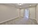 Spacious bedroom with neutral walls, plush carpet, and multiple closets for ample storage at 17834 Althea Blue Pl, Lutz, FL 33558