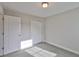 Neutral bedroom with a double closet at 17834 Althea Blue Pl, Lutz, FL 33558