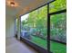Spacious screened lanai offering views of trees and manicured lawn at 17834 Althea Blue Pl, Lutz, FL 33558