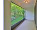 Screened lanai with peaceful views of mature landscaping and a wooded area at 17834 Althea Blue Pl, Lutz, FL 33558