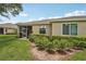 Nice backyard with screened-in patio, garden area, and well-kept lawn with room to enjoy the outdoors at 2032 Inverness Greens Dr # 76, Sun City Center, FL 33573
