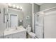 Bathroom with a walk-in shower, and modern fixtures at 2032 Inverness Greens Dr # 76, Sun City Center, FL 33573