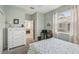 This bedroom features neutral walls, a ceiling fan, and a bright window at 2032 Inverness Greens Dr # 76, Sun City Center, FL 33573