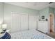 Bedroom featuring ample closet space, neutral walls, and a ceiling fan at 2032 Inverness Greens Dr # 76, Sun City Center, FL 33573