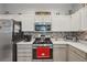 Close-up of a kitchen featuring modern appliances, a tiled backsplash, and plenty of counter space at 2032 Inverness Greens Dr # 76, Sun City Center, FL 33573
