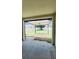 Covered patio with view of a well-maintained backyard and fence at 221 Fairmont Dr, Spring Hill, FL 34609